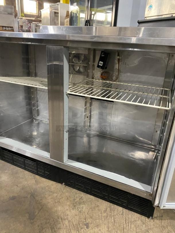 Duke RUF-48M stainless steel 2-door refrigerated worktop, Energy Star certified, with backsplash and poly-coated wire racks.