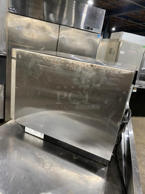 Amana 2014 commercial stainless steel microwave oven, model RC30S2, with programmable touchpad controls. Slight wear visible.