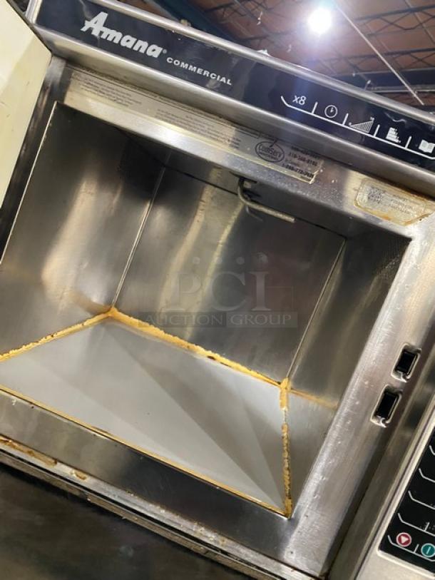 Amana 2014 commercial stainless steel microwave oven, model RC30S2, with programmable touchpad controls, interior view.