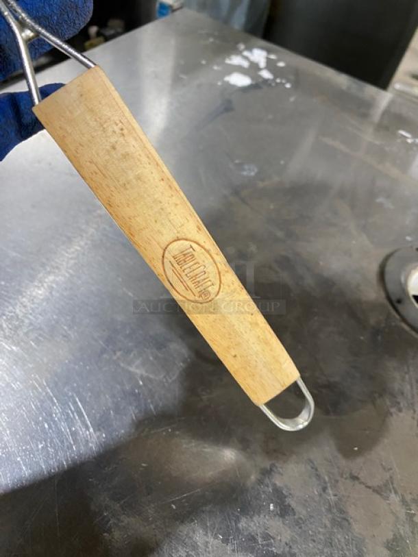 Tablecraft round double mesh tin strainer with wooden grip handle, brand logo embossed. New condition, heavy-duty design.