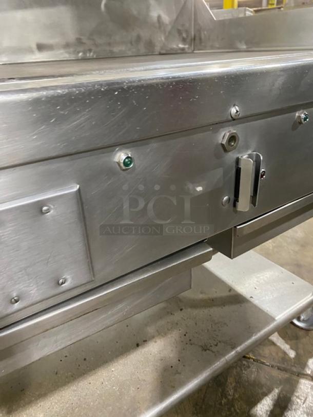 WoodStone stainless steel natural gas countertop plancha griddle with back and side splash, undershelf cart, on casters.
