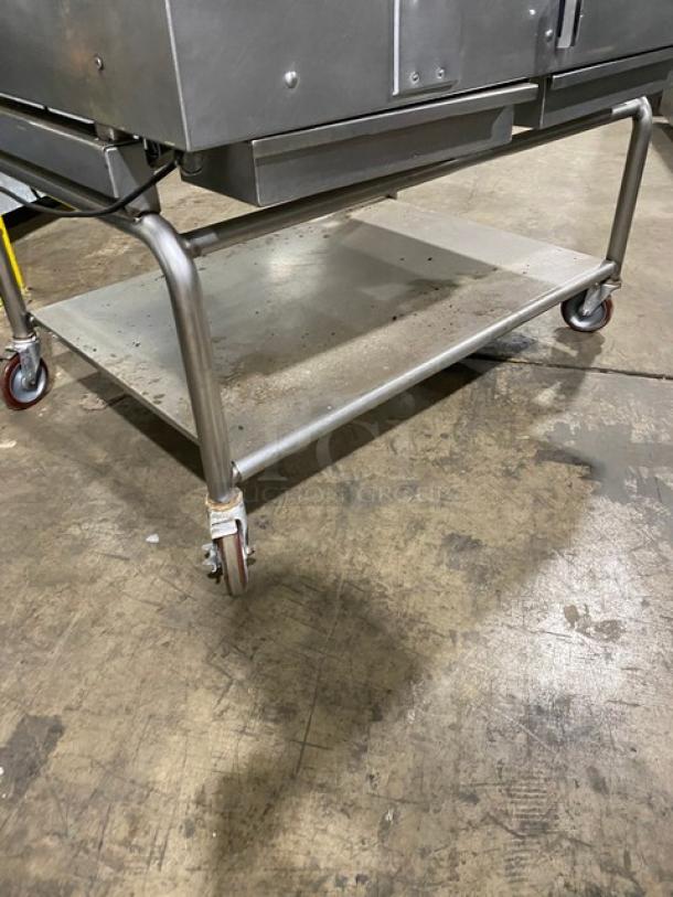 WoodStone stainless steel natural gas countertop plancha griddle with back and side splash, undershelf cart on casters.