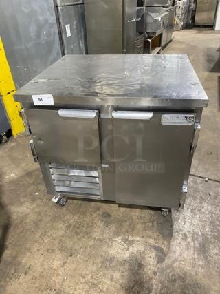 Leader LB36SC stainless steel 2-door refrigerated worktop lowboy with wired rack. Serial: PT010646a. On casters, 115V 1-phase.
