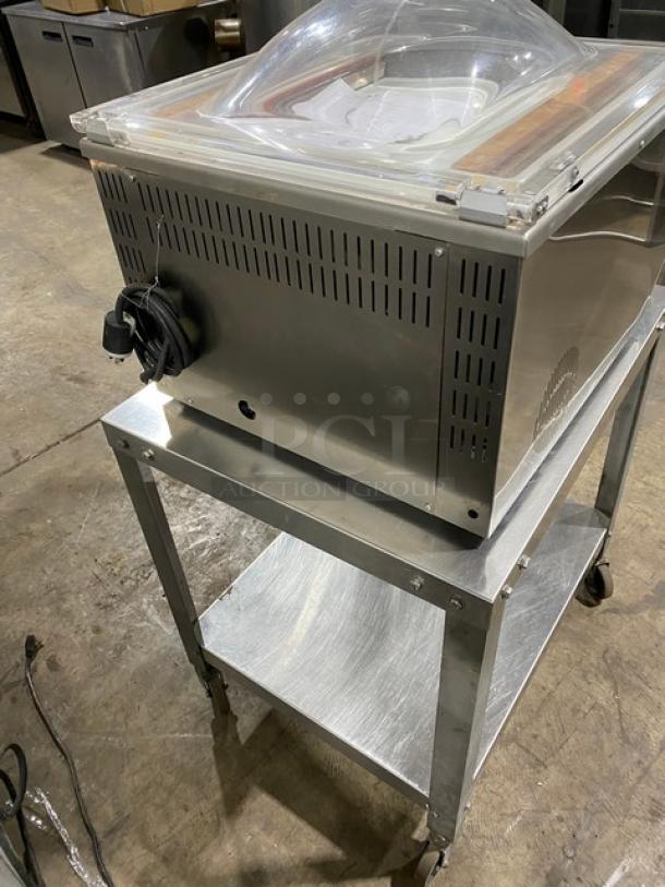 Minipack-Torre MV45X chamber vacuum sealer, like new, stainless steel, on casters, includes single undershelf equipment stand.