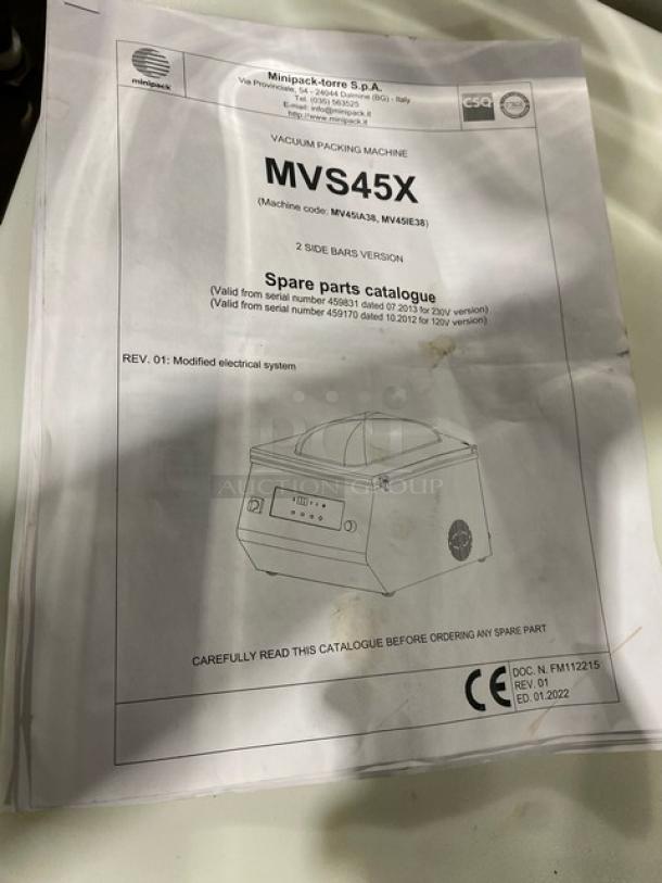 Instruction manual for Minipack-Torre MV45X vacuum sealer, showing machine illustration and technical details.