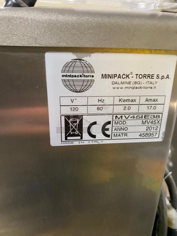 Minipack-Torre MV45X stainless steel vacuum sealer, like new, 120V, on casters with model and serial label, includes stand/cart.