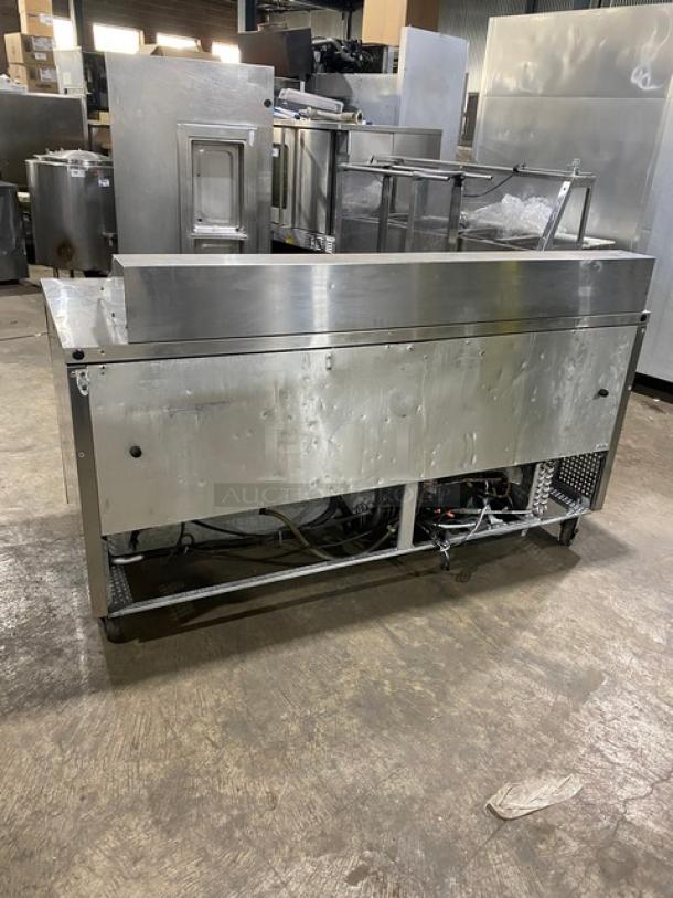 True TSSU-72-18 3-door refrigerated prep table, stainless steel, on casters, ideal for salads/sandwiches, used condition.