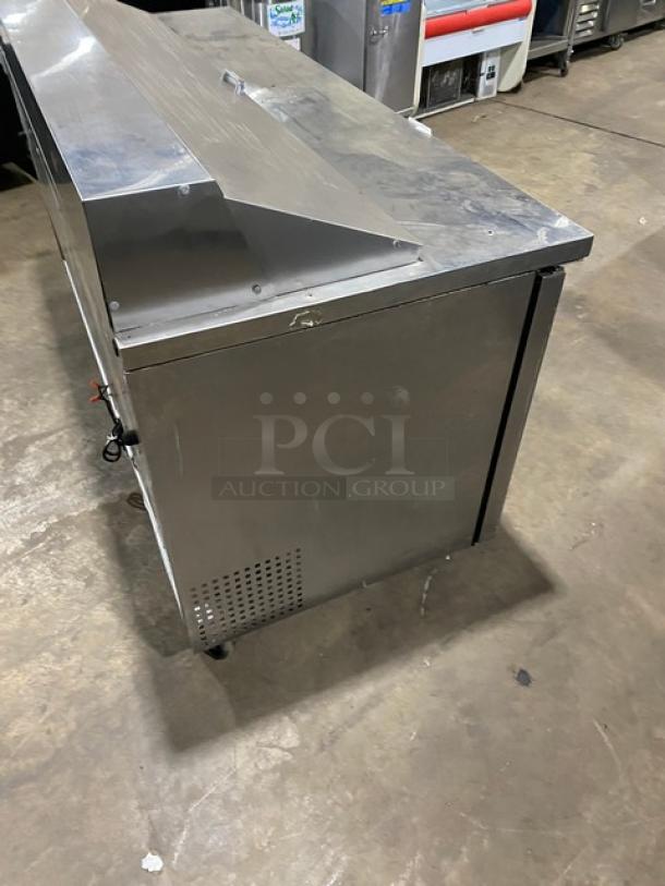 True TSSU-72-18 stainless steel 3-door refrigerated salad/sandwich prep table, 115V, on casters, used condition.