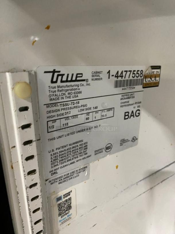 True TSSU-72-18 stainless steel 3-door refrigerated prep table label, 115V, serial 1-4477558, on casters.