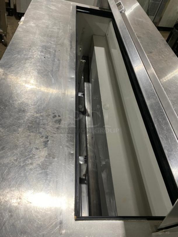True TSSU-72-18 stainless steel 3-door refrigerated prep table, bain marie style, on casters, used condition.