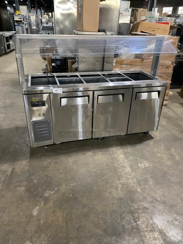 Turbo Air JBT-72-N commercial stainless steel 3-door refrigerated buffet display with sneeze guard, poly-coated wire racks, on casters.