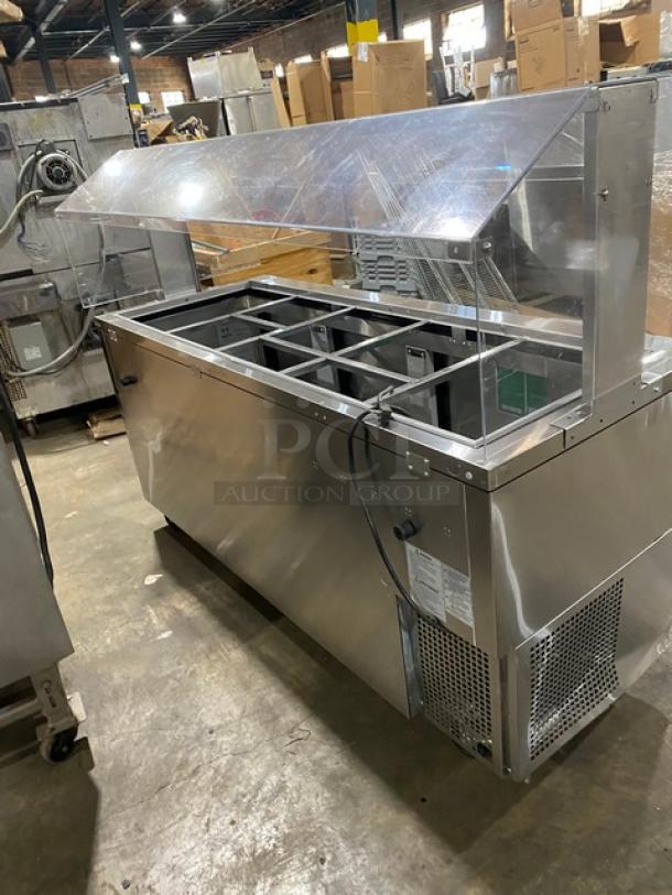 Turbo Air JBT-72-N stainless steel 3-door refrigerated buffet table, sneeze guard, poly coated racks, 115V, on casters.