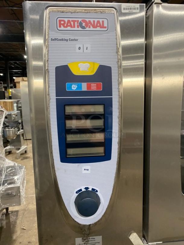 Rational SelfCooking Center SCC62G commercial combi oven, double-stacked, stainless steel, natural gas, with wired racks and blue hose.