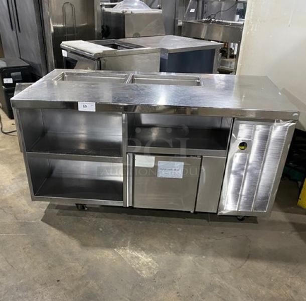 Stainless steel single door refrigerated prep table with enclosed storage shelves, on casters. Ideal for commercial use.