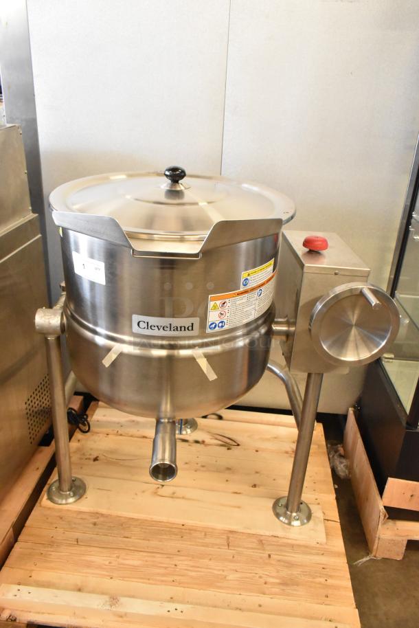 Cleveland KDL-25-T 25-gallon stainless steel steam kettle, new with minor scratches and dents, features tilt mechanism.