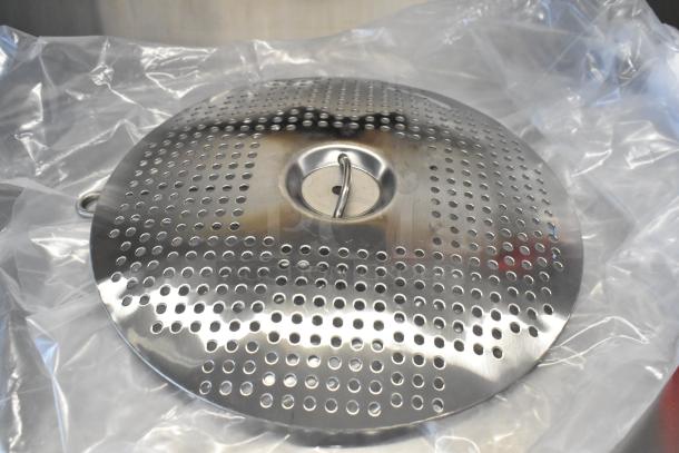 Cleveland KDL-25-T stainless steel perforated lid on protective plastic, part of a 25-gallon steam kettle. Brand new condition.