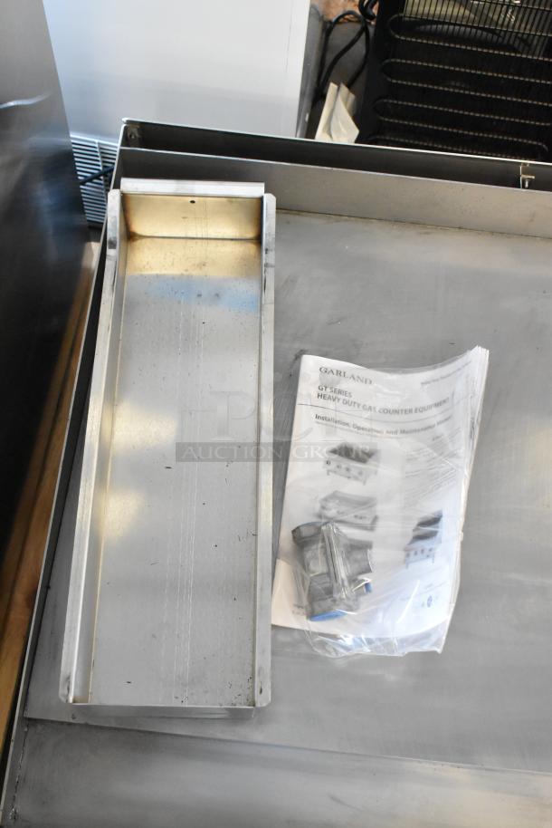 Garland Stainless Steel Commercial Countertop Flat Top Griddle. Includes manual and accessories. Used condition, clean surface.