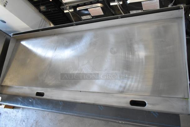 Garland stainless steel commercial countertop flat top griddle, gently used, with a spacious cooking surface.