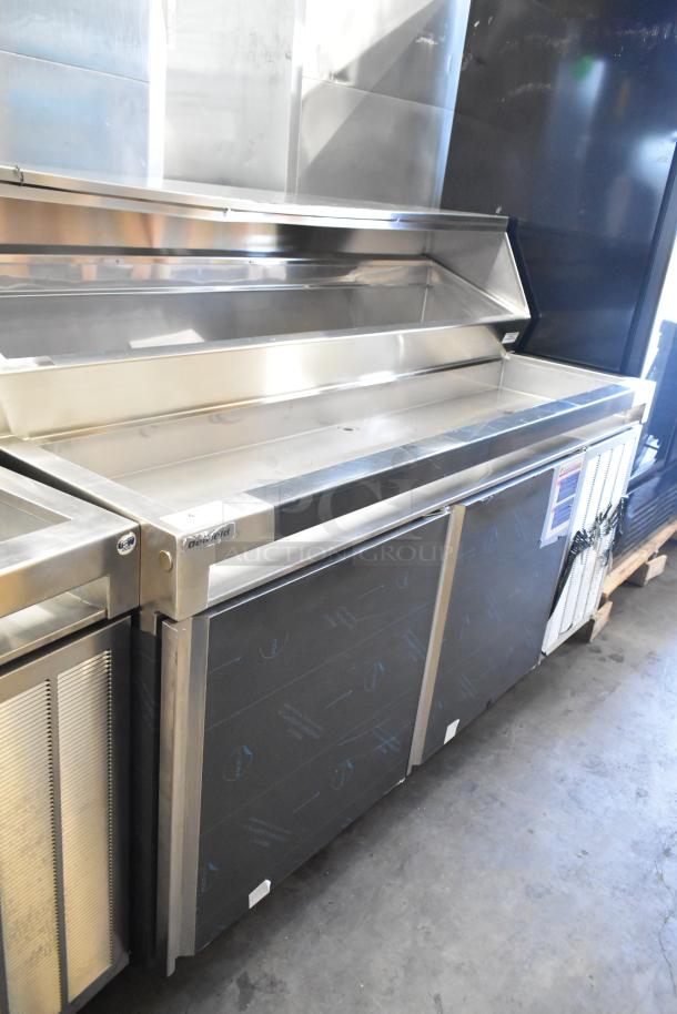 Delfield stainless steel commercial prep table, 115V, 1 phase, mounted on commercial casters, featuring spacious compartments.