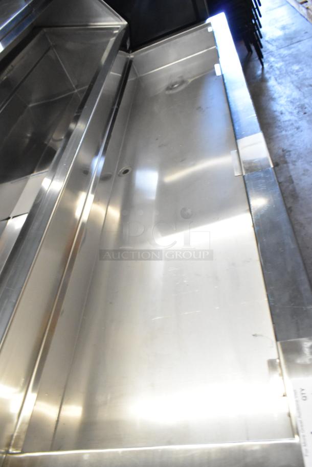 Delfield stainless steel commercial prep table on casters, 115 volts, 1 phase, in good condition.