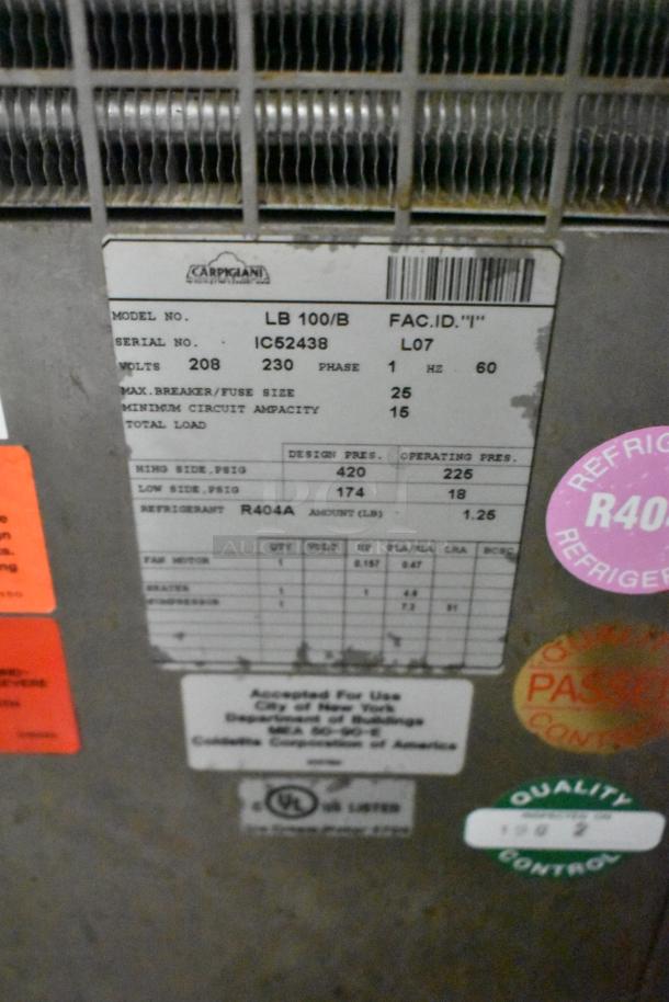 Carpigiani LB100/B stainless steel batch freezer, 208/230V, 1 phase. Features label with specs and quality control stickers.