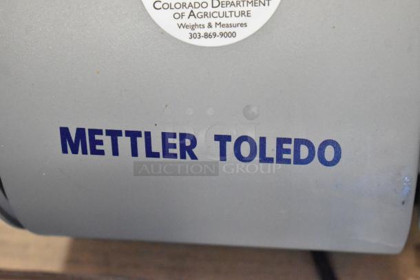 Mettler Toledo UCCW countertop food scale, commercial-grade, 100-240V, 1 Phase, with visible department of agriculture sticker.