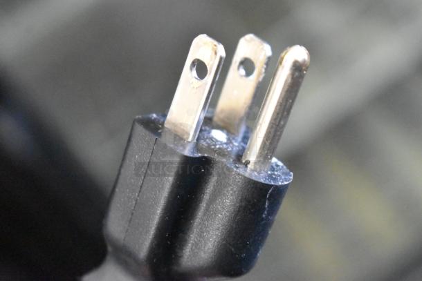 Close-up of a power plug compatible with the Mettler Toledo UCCW commercial food portioning scale.