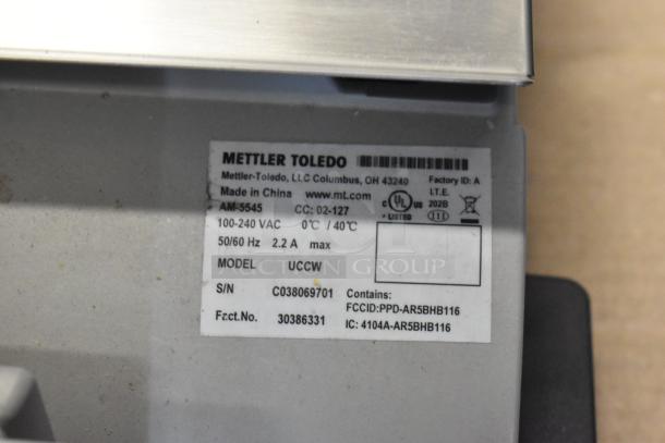 Mettler Toledo UCCW metal food portioning scale, label showing 100-240V, 1 phase, Model UCCW, S/N: C038069701.