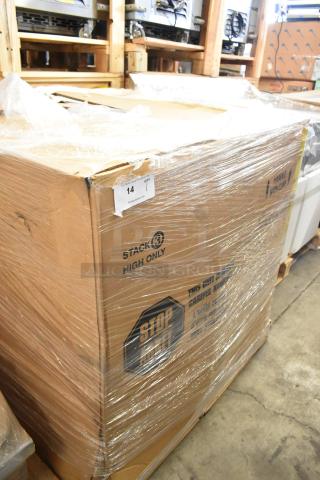 Sealed cardboard box with a Garland G3-BBB-R Stainless Steel Commercial Range inside. Marked "Scratch and Dent." Packaging has protective wrap.