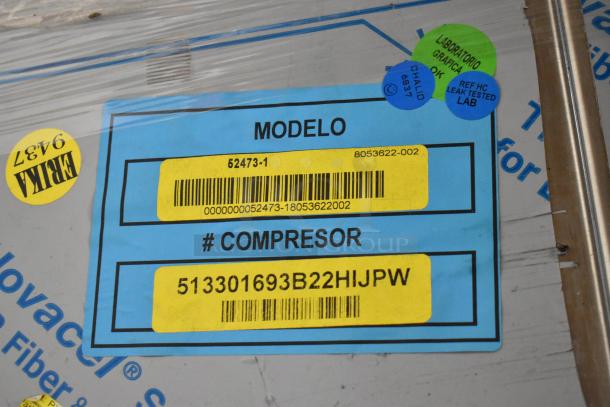 Alt Text: "BKI 52473-1 commercial meat freezer label, showing model number and compressor ID, brand new in crate."