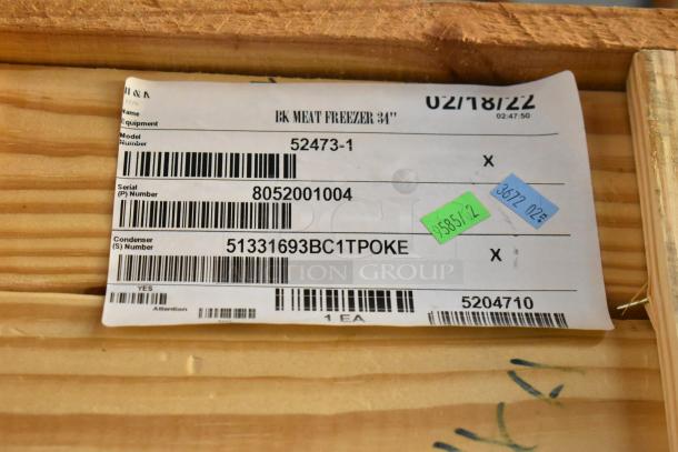 BRAND NEW BKI 52473-1 stainless steel commercial meat freezer, 115V, 1 phase, on casters. Image shows serial tag details.