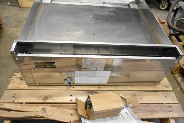 Brand new Southbend PE36N-TTT stainless steel electric griddle, 208V, 1 phase. Visible minor dents. Includes labels and instructions.