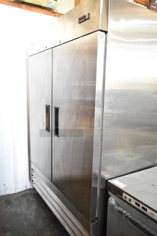 Brand new Avantco 178A49RHC stainless steel commercial two-door reach-in cooler with poly-coated racks and commercial casters.