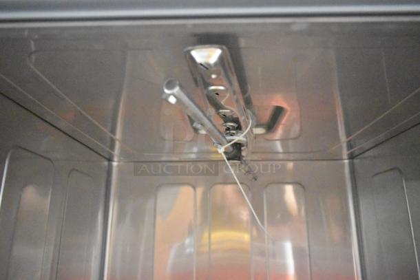 Stainless steel interior of a 2025 Mainstreet 541HTUC30 high-temp undercounter dishwasher, brand new, scratch and dent condition.