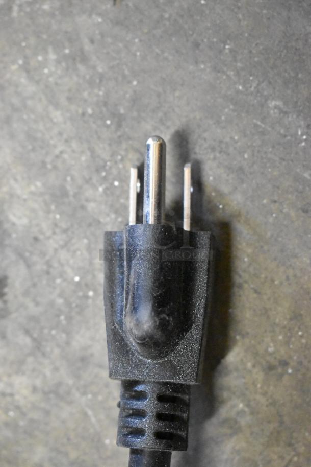 Close-up of a power plug for Avantco 177DPO18S countertop oven, black plastic, three-prong, indicative of 120 volts use.