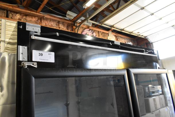 Brand new Mainstreet 829GMC49B reach-in cooler, metal frame, 2 glass doors, 115V, poly coated racks, minor scratches.