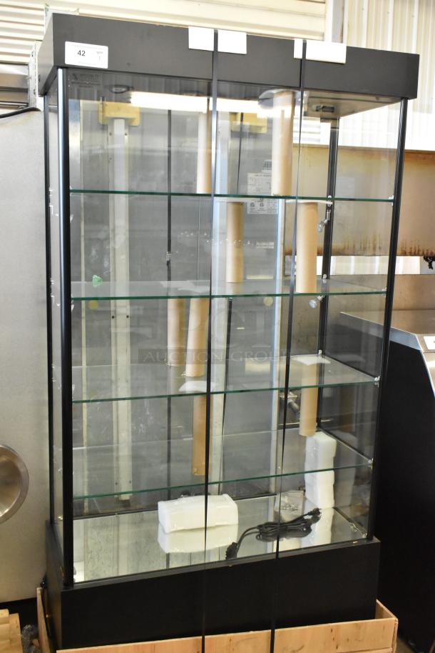 Brand new scratch and dent dry shelving unit display case; black frame, glass shelves, minor imperfections visible.