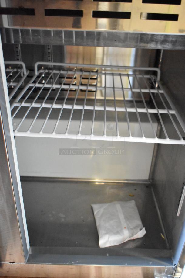 Brand new, scratch and dent Avantco 178APT36MHC sandwich salad prep table, visible shelving, 115 Volts, 1 Phase.