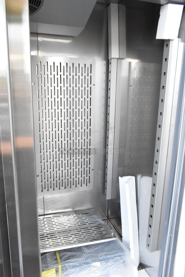 Brand new 2024 Avantco 178SS2RHC stainless steel 2-door reach-in cooler, poly-coated racks, interior view, 115V, 1 Phase.