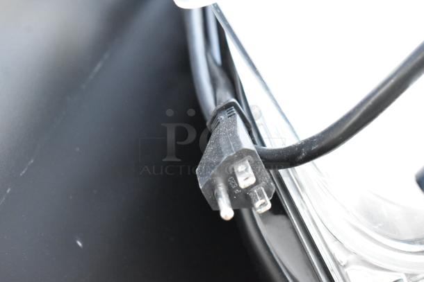 Close-up of the power cord for a brand new Elmeco BB2 GREEN commercial slushie machine, showing a standard electrical plug.