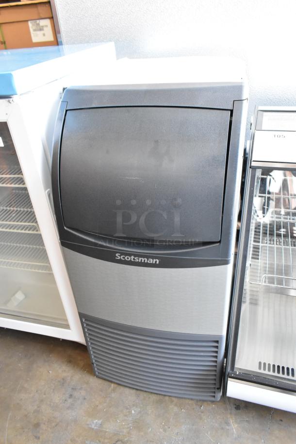 Brand new, 2023 Scotsman CU0415MA-1A stainless steel undercounter ice machine, 58 lb., 115V, showing minor scratches.