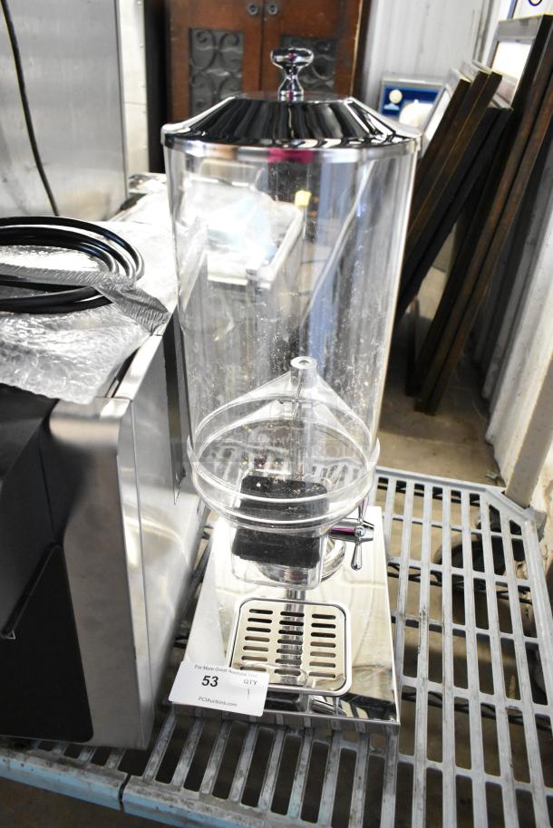 Brand new metal and poly dry dispenser, scratch and dent condition. Includes dispensing lever and drip tray. Tags show item number 53.
