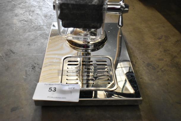 Brand new metal and poly dry dispenser with scratches and dents visible; tag showing "53" from PCAuctions.com.