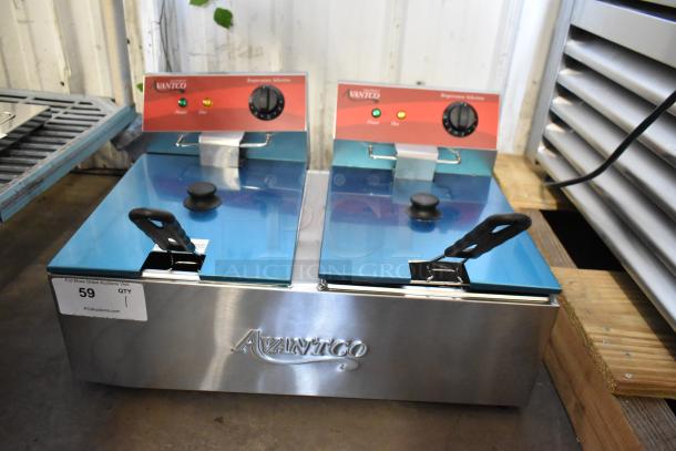 Brand new Avantco 177F102 stainless steel 20 lb. dual tank electric fryer with two metal baskets and lids. 120V, 1 Phase.