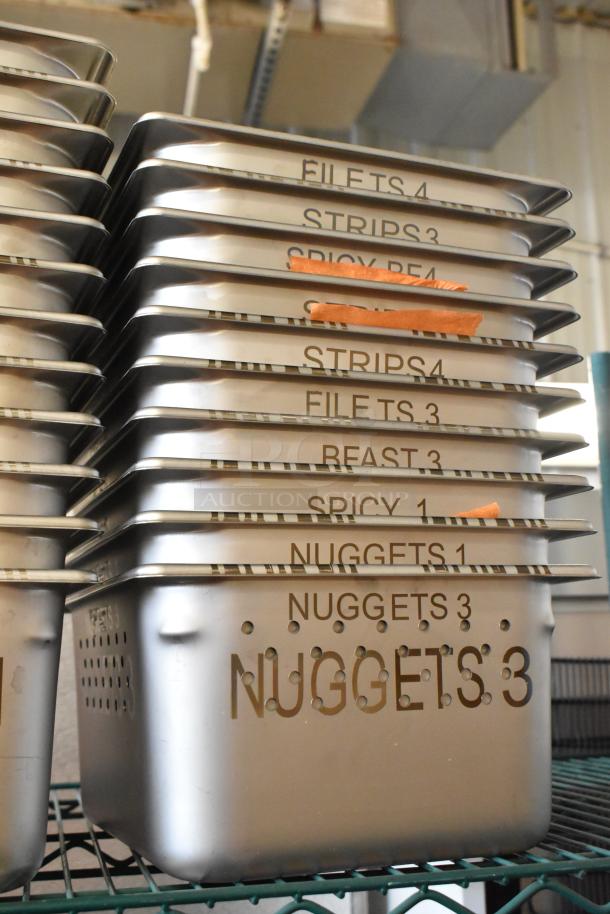 22 new stainless steel drop-in bins, labeled with various food types. Minor scratches and dents visible.