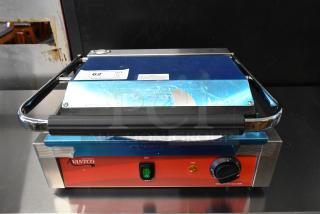 Brand new 2023 Avantco 177PG200GS stainless steel commercial panini grill with grooved top, smooth bottom, 13 3/8" x 8 3/4" surface.