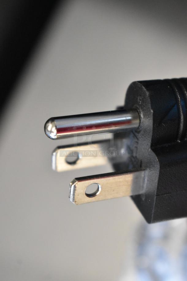 Close-up of a power plug for the Avantco 177PG200GS Panini Grill, showing a three-pronged black connector.
