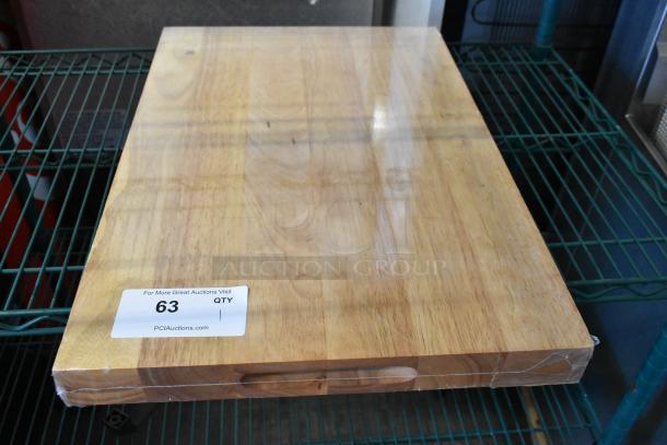 Brand new Choice 407WCB2416 wood cutting board, 24" x 16" x 1 3/4", squared edges, minor scratches, auction tag visible.
