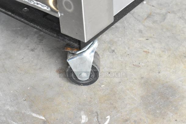 2024 True T-19F-HC freezer corner detail with stainless steel build and heavy-duty commercial caster for mobility.