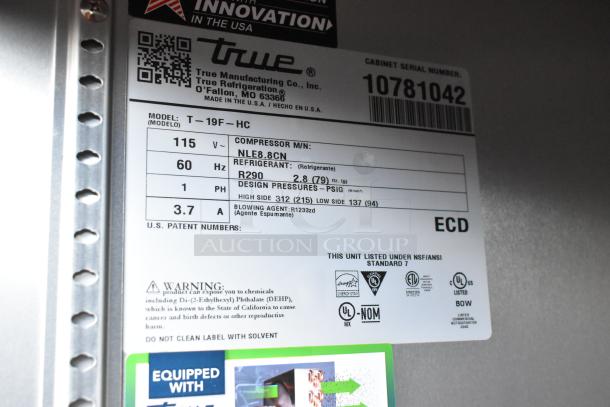 2024 True T-19F-HC stainless steel commercial single door reach-in freezer with poly-coated racks, on commercial casters; 115V, 1 phase.